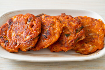 Korean Kimchi pancake or Kimchijeon - Fried Mixed Egg, Kimchi, and Flour