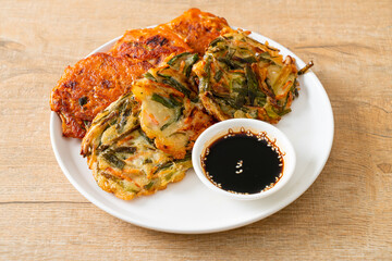 Pajeon or Korean pancake and Korean Kimchi pancake or Kimchijeon on white background