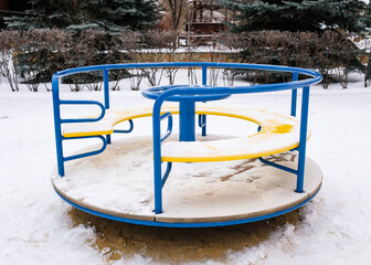 Carousel for children in winter in the park