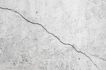Fototapeta Cracked concrete wall surface with white paint for background obraz