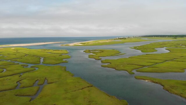 Cape Cod Bay Aerial Drone Footage of Bay Side Marsh headed towards Springhill Beach.