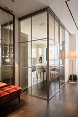 glass partition in a modern interior, interior of the penthouse, kitchen behind glass doors