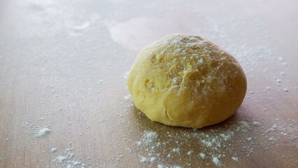 kneading dough at home. Kneading Dough in the Kitchen. Housewife cooking on kitchen at the home.