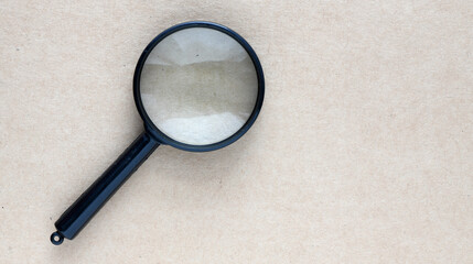Black magnifier on a light background