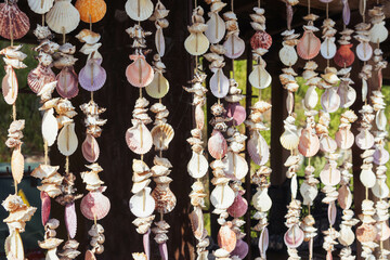 pendants with multi-colored shells are made by hand, they hang