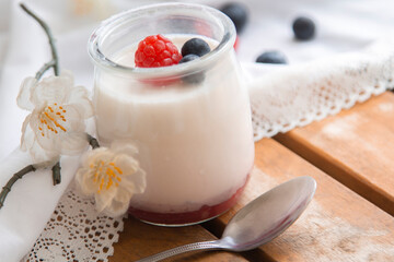 Obraz na płótnie Canvas Yogurt with Fresh Berries on Woden Table