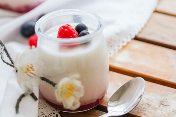 Yogurt with Fresh Berries on Woden Table