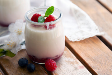 Yogurt with Fresh Berries on Woden Table