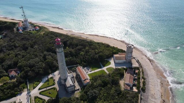 Aerial fly over drone footage of the Phare des Baleines or Lighthouse of the Whales and sea view on Ile de R&eacute; or island of Re France