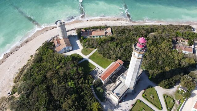 Aerial static drone footage of the Phare des Baleines or Lighthouse of the Whales and sea view on Ile de Ré or island of Re France