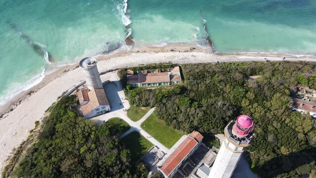 Aerial fly over drone footage of the Phare des Baleines or Lighthouse of the Whales and sea view on Ile de R&eacute; or island of Re France