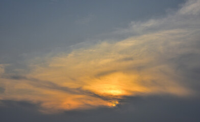 Naklejka na ściany i meble Dramatic clouds with sun ray effect