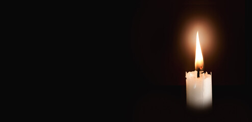 candle flame isolate on black background, symbol of prayer and remembrance