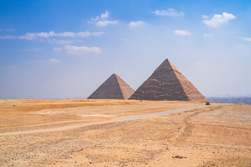 The impressive pyramids of Cheops and Kefren with the city of Cairo in the background. Photograph taken in Giza, Cairo, Egypt.