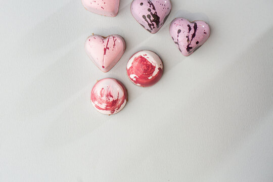 Luxury handmade chocolate heart form candy isolated on bright background. Exclusive handcrafted bonbon. Product advertising concept for pastry shop