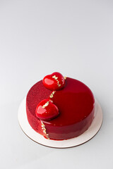 Red mirror half glazed and velor entremets with mini hearts and gold.
