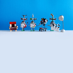 The film crew robots shoots motion picture. Cinema television team robotic director, assistant with...