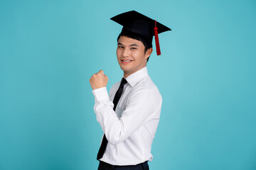 Young asian nerd man wearing wearing a school uniform and graduation cap smiling looking confident...