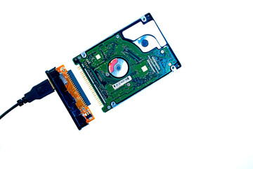 Hard disk IDE and USB adapter on a white background.