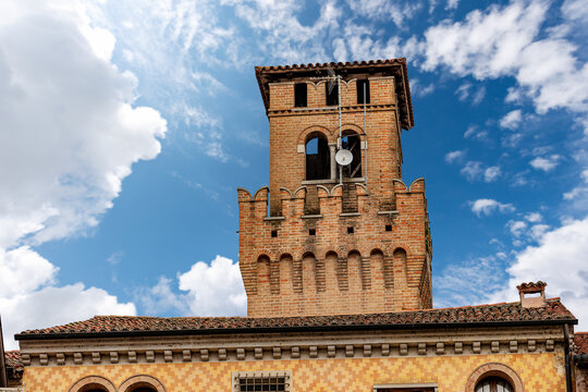 Small town of Oderzo in Treviso province, Veneto, Italy, Europe. Close-up of the medieval clock and bell tower called Torresin, town square called Piazza Grande.