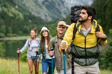 Group of friends on a hiking, camping trip in the mountains