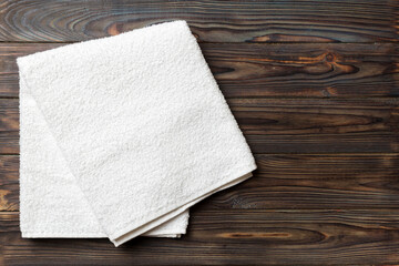 Top view of white towels with copy space on colored background