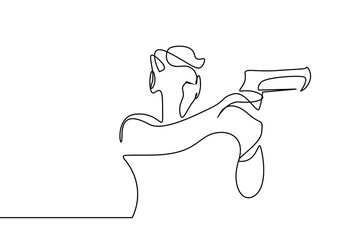 a person squints and aims with a gun in his hand