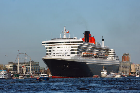 Hamburg, Germany - August 19, 2012: Queen Mary 2, the luxurious Cunard Liner leaves the port of Hamburg after participating in the Cruise Days Parade. Blue Port Hamburg 2012.