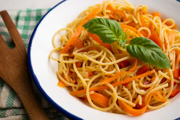 Spaghetti with carrot and vegetables. Traditional Italian recipe.