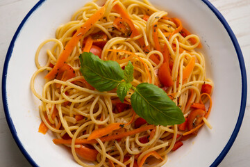 Spaghetti with carrot and vegetables. Traditional Italian recipe.