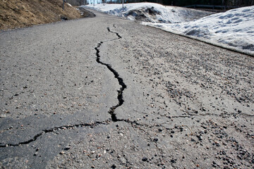 cracked asphalt road surface texture
