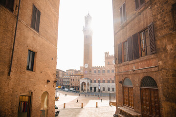 Piazza del Campo, Palazzo Pubblico, Torre del Mangia. Campo Square, Town Hall, Mangia Tower in Siena, Tuscany, Italy. Landmarks and ancient architecture of Siena.