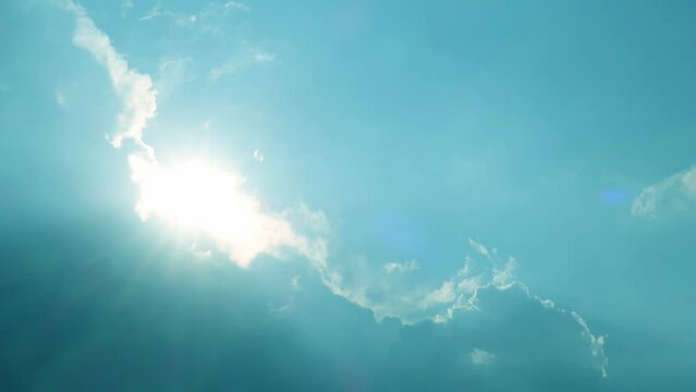 sun light rays n sunset or sunrise clouds on cyan blue sky