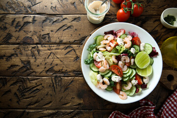 Healthy vegetable salad with shrimps