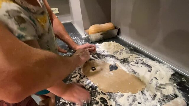 The process of making gingerbread cookies with molds for Easter