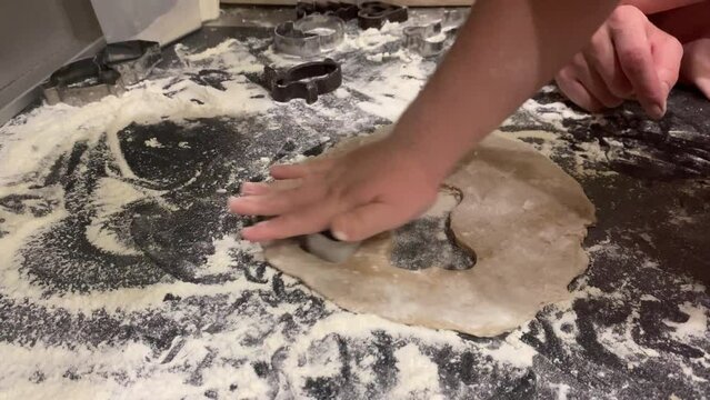 The process of making gingerbread cookies with molds for Easter