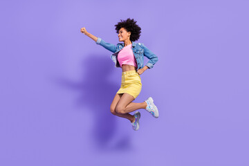 Full length body size view of attractive cheerful slim girl jumping striving action isolated on bright violet purple color background