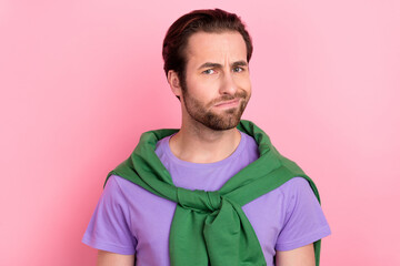 Photo of sad millennial brunet man look camera wear purple t-shirt isolated on pink color background