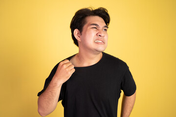 portrait of young asian man feeling the hot weather