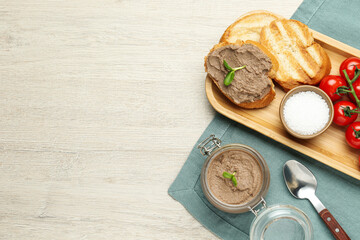 Flat lay composition with delicious liver pate on white wooden table, space for text