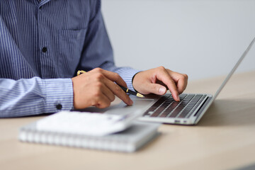 Close up business man working on laptop. Modern Finance and Accounting Concepts Using Accounting Software