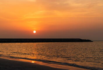 Fototapeta premium Shot of a dramatic sunset by the beach. Nature