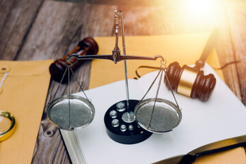 Justice and Law concept. Legal counsel presents to the client a signed contract with gavel and...