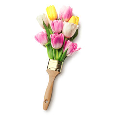 Creative design with paint brush and beautiful tulips on white background, top view. Spring is...