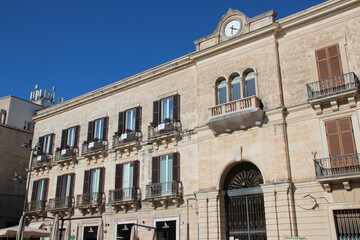 Fototapeta na wymiar palace or ancient flat building at archimede square in syracusa in sicily in italy 