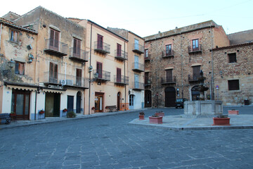 square and ancient buildings (houses or flat buildings) in castelbuono in sicily in italy 