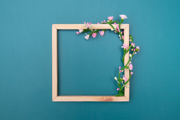 Square wooden frame mock up with decorative floral ornaments with copy space top view