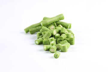 Long beans on a white background close-up photo of green vegetables. It's a kind of nut. It can be eaten raw as a side dish