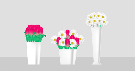 set of bouquets of flowers in a white vase. daisies and pink tulips in a pot.