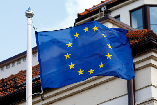 European union flag on the background of a classic european house